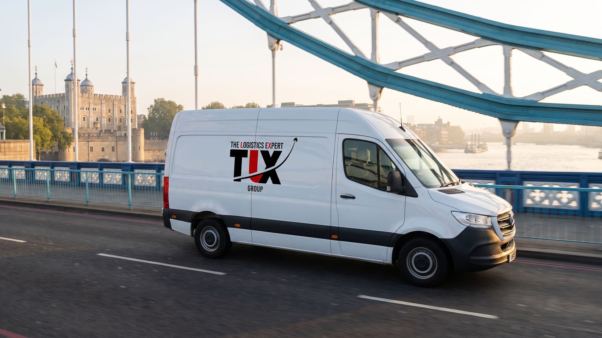 TLX Group van crossing Tower Bridge, London, at sunrise