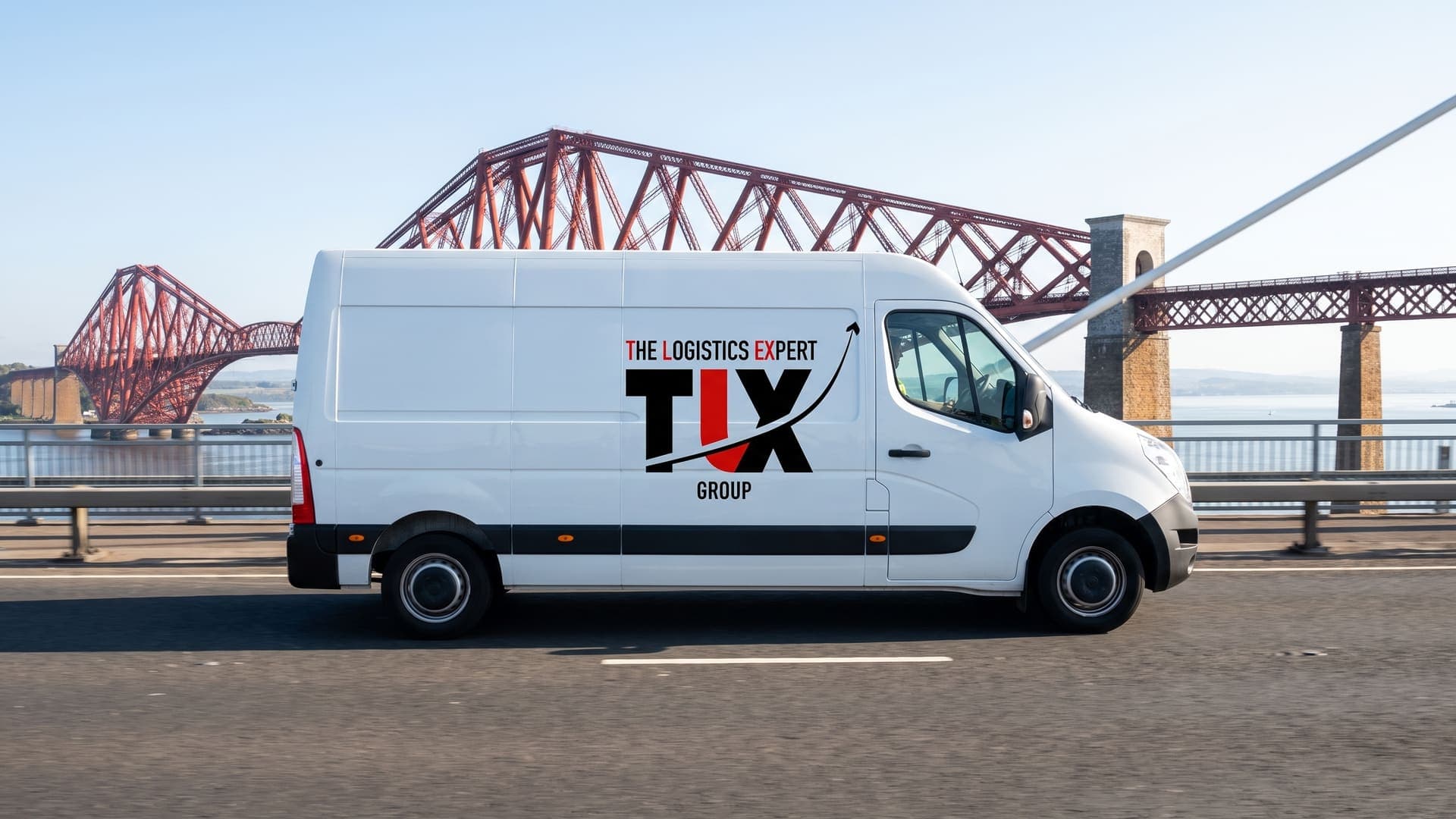 TLX Group van crossing the Forth with the Forth Bridge behind