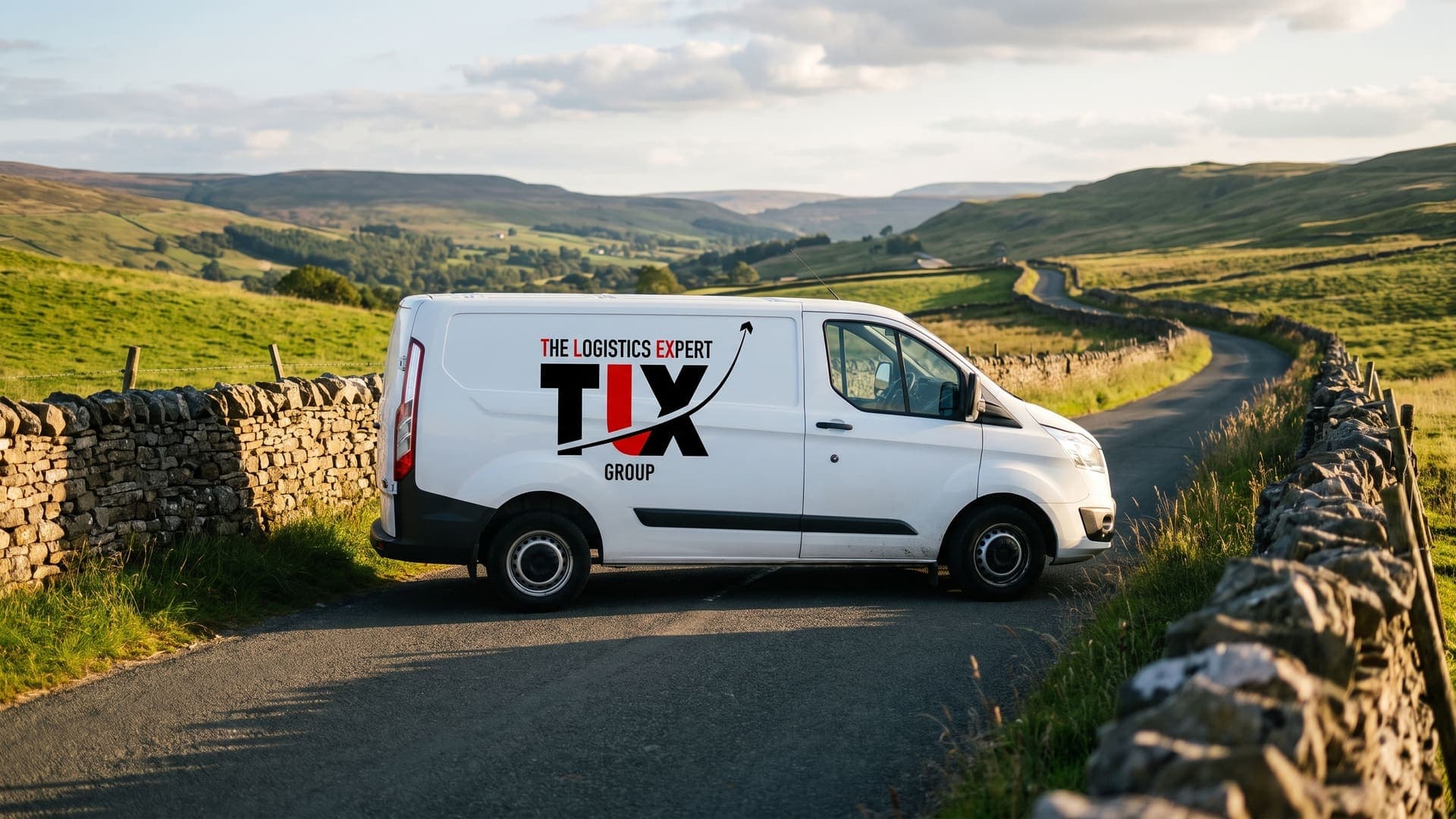 TLX Group van on a dry-stone-walled road in the Yorkshire Dales
