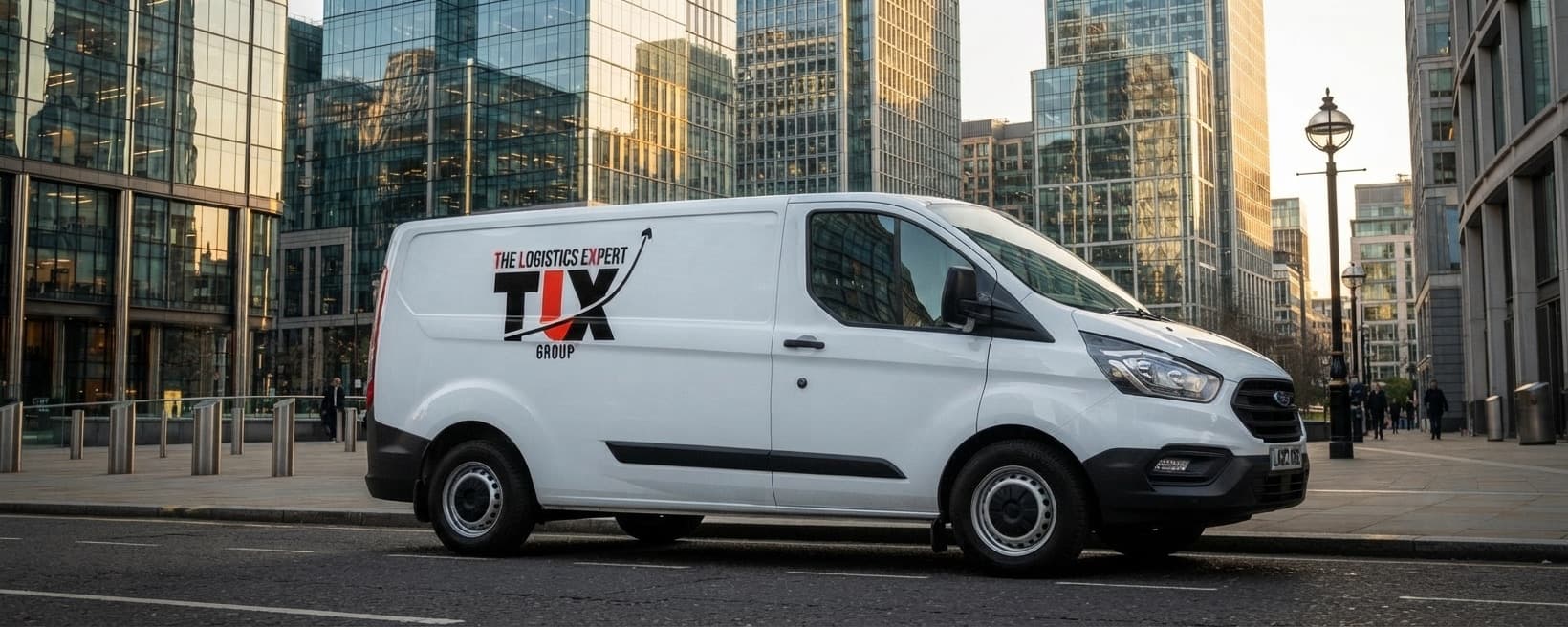 TLX Group van in a financial district among glass office towers