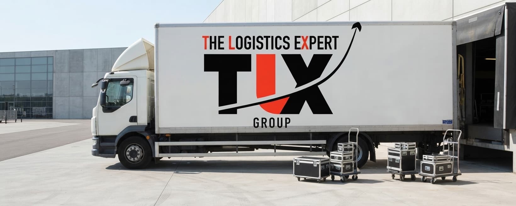 TLX Group 18 tonne truck with flight cases at an exhibition centre loading bay