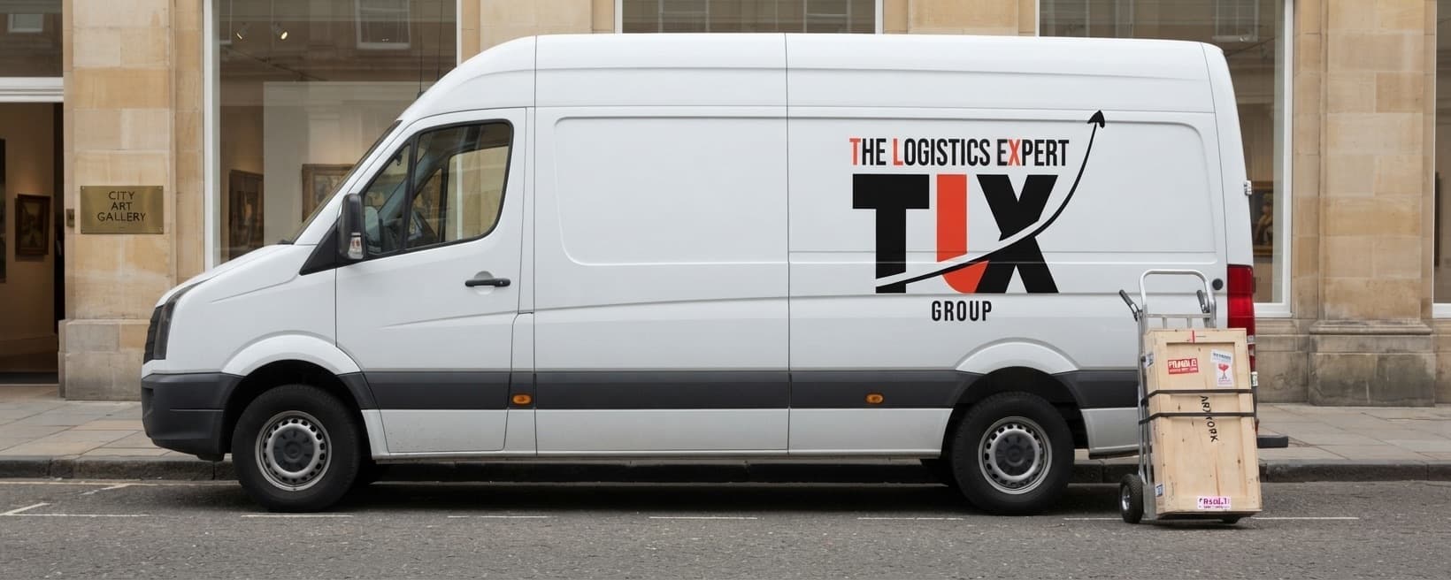 TLX Group van outside an art gallery with a crated artwork on a sack truck